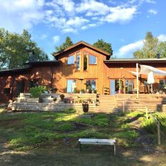 Wonderful wooden house next to lake and Stockholm archipelago