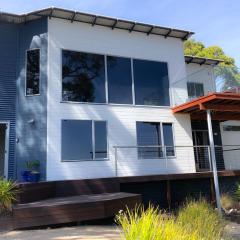 BAY OF FIRES BEACH SHACK ocean views from a modern Beachhouse