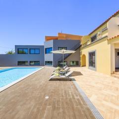 4 bedrooms house with sea view shared pool and enclosed garden at Quelfes