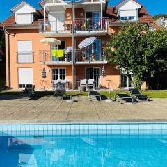 Das Schneckenhaus - Ferienwohnung mit Pool & Seeblick