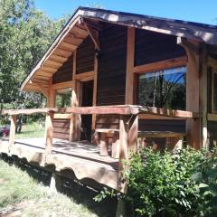 Wonderful rustic cabin 2, with native logs, on the banks of the Trancura River