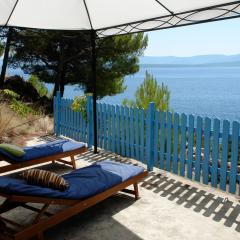 A small stone house by the sea, in a wineyard