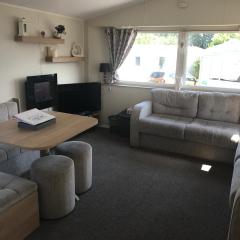 Stunning deluxe 3 bedroomed caravan with CH, DG and decking.