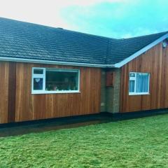 Shore Lodge. 4 bed bungalow only mtrs from the beach. Sleeps 8