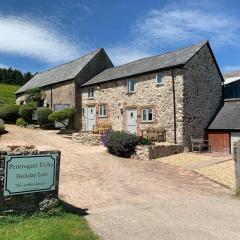 The Nook at Pentregaer Ucha, with tennis court & lake.