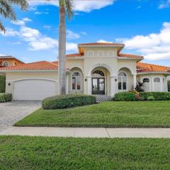 SW exposure home on wide canal with pool and spa