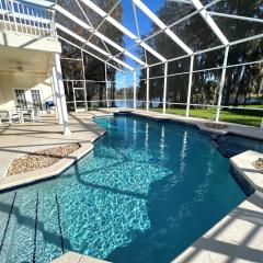 Mickeys Homestead - Stylish 4BR Lakefront Cottage with Huge South Facing Pool Hot Tub BBQ - 2 miles Disney!