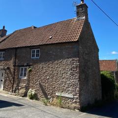 The Nook- A Rustic Cottage in a Beautiful Village.