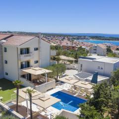 Family friendly apartments with a swimming pool Novalja, Pag - 14275