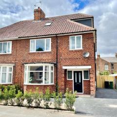 Central Townhouse with free off road parking and garden