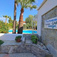 Mediterranean poolside garden cottage