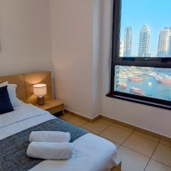 Luxe, spacious, 2BD Condo with Full kitchen, Marina View, Steps from JBR Beach, Tram & Marina by "La Buena Vida Holiday Homes"