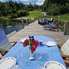 Timber house with private beach and boat including.