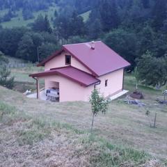 House with big garden next to the mountain river