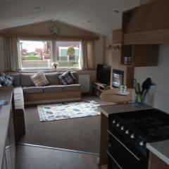 D24 is a 2 bedroom 6 berth caravan close to the beach on Whitehouse Leisure Park in Towyn near Rhyl with decking and private parking space This is a pet free caravan