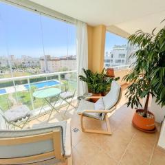 Bright apartment with terrace, pool and beach