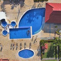Centrally located in Jaco, walk to beach, beautiful pool! Each Villa Paradise is 1bd 1bath Condo Units sleep 5 or book both units and open connecting door for 10 ppl- Paradise Found!