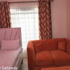 Comfy Getaway STUDIO apartment near JKIA & SGR with KING BED, WIFI, NETFLIX and SECURE PARKING