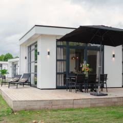 Luxury holiday home on the water, located in a holiday park in the Betuwe