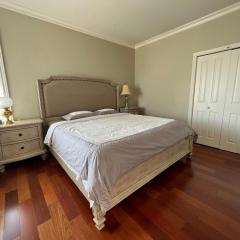 A cozy bedroom with a private washroom close to YVR Richmond