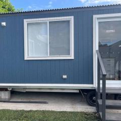 Sweet Cute blue tiny home with Pool and 2 minute drive to the beach