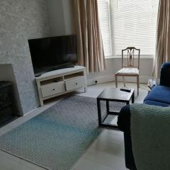 Seaside 2 bed terraced house with garden and free parking