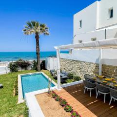 The Sea House beach front villa with pool