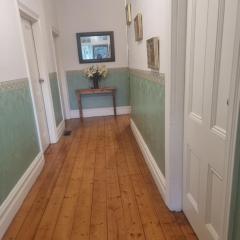 Large bedroom with twin beds and private bathroom