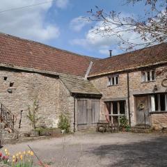 Converted stables and hayloft in former farmyard