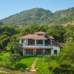 StayVista's House Below The Hill - A stylish Mountain-view villa with Pool and Games room