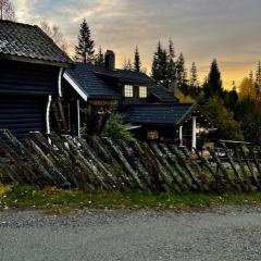 Koselig rom i tømmerhus, inkl morgenkaffe