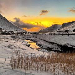 Experience unique Faroe Islands holiday home by the sea with great views, fully equipped kitchen and reliable Wi-Fi