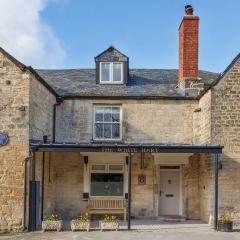 A handsome large 9 bedroom 17th Century village house moments from The Cotswold Way offering modern luxury in a peaceful location