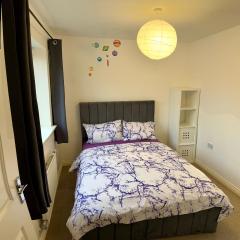 Comfortable double room with shared spaces