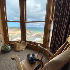 HUER'S WATCH a beautifully presented PRIVATE APARTMENT with far reaching VIEWS Over ST IVES HARBOUR and BAY and FREE ONSITE PARKING for LARGER GROUPS book along with our Connecting TWO SISTER APARTMENTS
