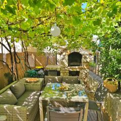 Holiday Place Veli Dvor - vacation house with private garden in old town Punat