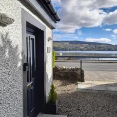 Lochside cottage with scenic terrace views, Argyll