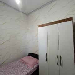 Quarto em Apartamento no Centro