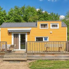 Yellow Tiny House with shared pool