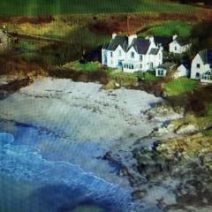 Unique house in an idyllic situation on a beach