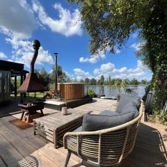 New- The Cabana- With Sauna and Hot Tub, on a lake near Amsterdam