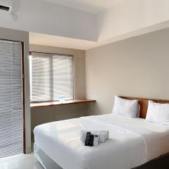 Homey and Minimalist Studio Gateway Park LRT City Jatibening Apartment By Travelio