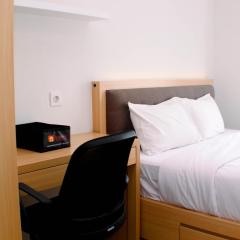 Comfort 1BR at Vasanta Innopark Apartment By Travelio