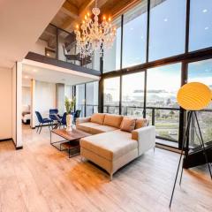 Skyline Suites - Elegant Living with Coworking & Scenic Views