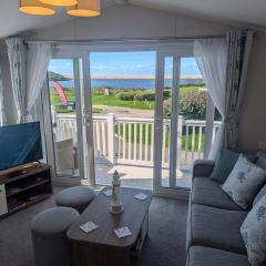 STYLISH HOLIDAY HOME WITH UNINTERRUPTED VIEWS OF THE FLEET LAGOON ON Haven LITTLESEA HOLIDAY PARK