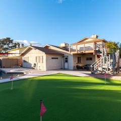 Fun 5 bedroom home by strip, pool, putting green, and games