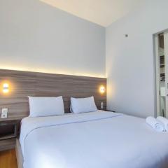 Comfort 1BR at Amartha View Apartment By Travelio
