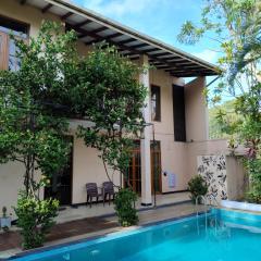 A tropical paradise; stunning house, pool, garden