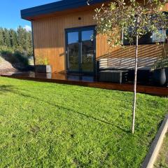 Tiny home with mountain and orchard views