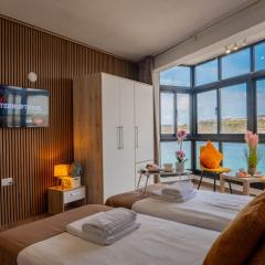 Sunny Beach House with Jacuzzi - Steps from the Sea!